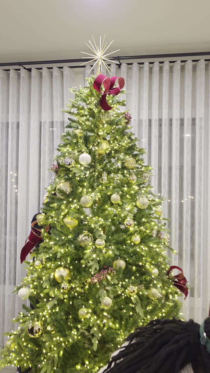 The Curator Atelier team dressing a residence tree